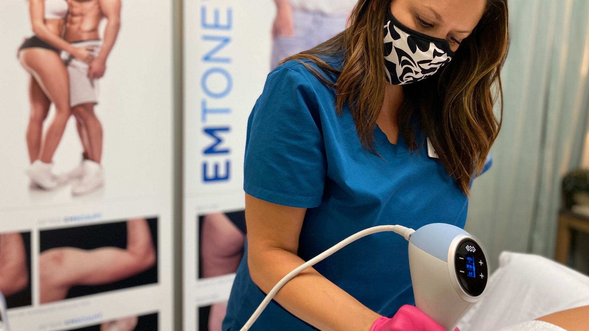 A practitioner performs an Emtone treatment in Bentonville