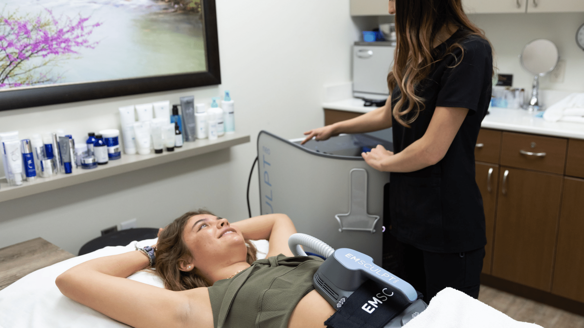patient receiving Emsculpt treatments after laser hair removal in Bentonville